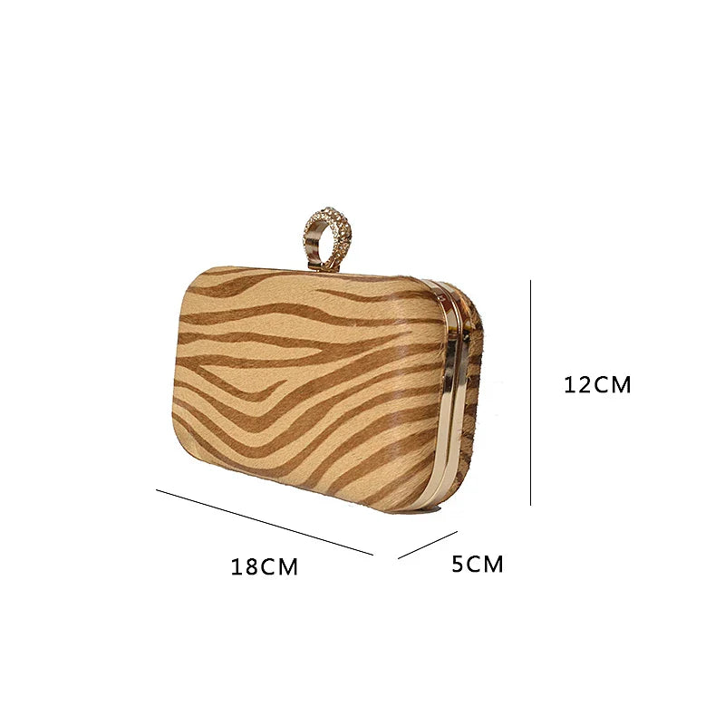 A premium handcrafted messenger bag made with luxurious horsehair and featuring a unique colourful brick ring buckle closure, showcasing the timeless charm of British craftsmanship.