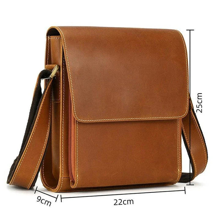 Premium leather crossbody bag with flap closure, vertical square shape, and multiple interior compartments