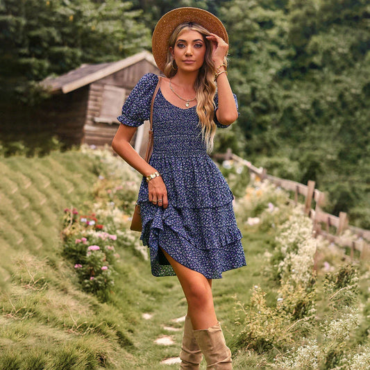A stylish one-shoulder mini dress with a vibrant floral print, ruffle detailing, and an A-line silhouette.
