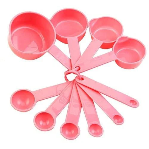 A set of 10 pink baking measurement cups and spoons made from food-grade plastic for precise ingredient measurements