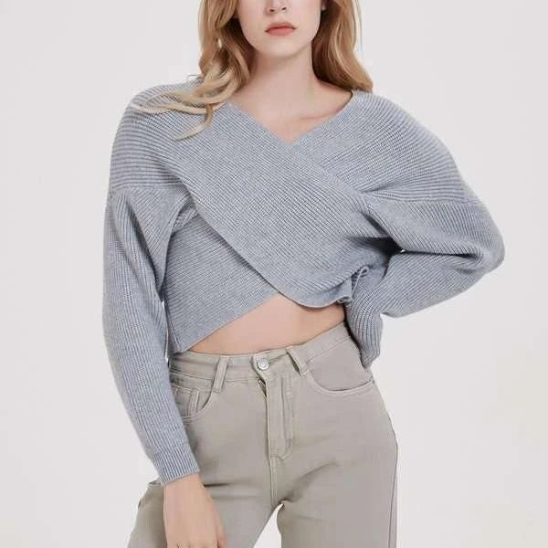 A cosy, brown V-neck knitted jumper with a relaxed, comfortable fit and a touch of vintage-inspired style.