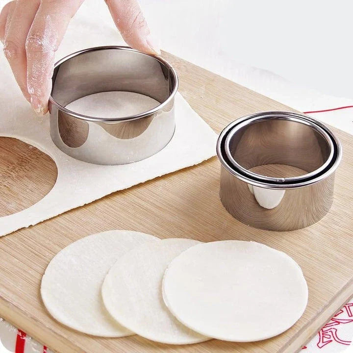 Premium stainless steel dumpling maker set with three distinct mold sizes for creating a variety of dumpling shapes