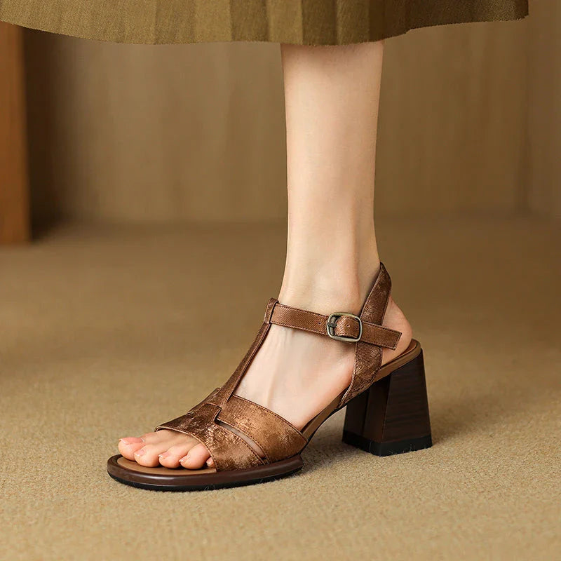 Genuine leather gladiator sandals with chunky heel, open-toe design, and secure buckle closure for summer style and comfort.
