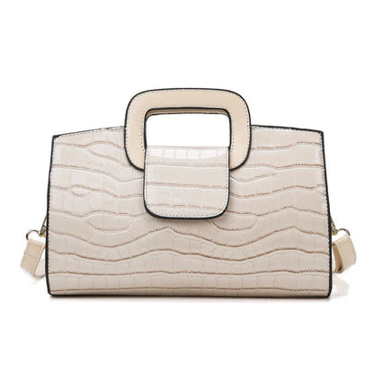 A stylish and versatile retro-patterned handbag with a sturdy canvas construction and organised interior, perfect for everyday use in the UK.