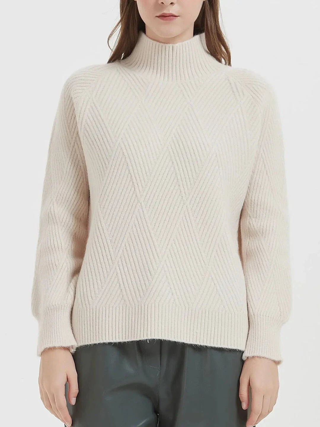 A cosy and stylish knitted turtleneck sweater in a classic beige colour, perfect for layering during the autumn and winter seasons.