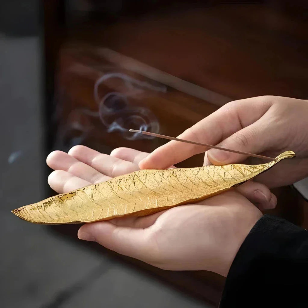 Elegantly crafted copper alloy incense holder with Bodhi leaf design, perfect for meditation and home decor