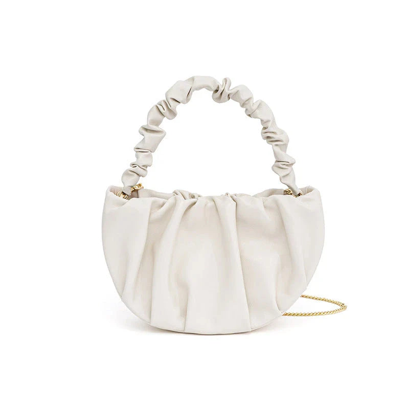 Luxurious sheepskin pleated crossbody bag in various colours, featuring a chic and contemporary design perfect for any occasion.