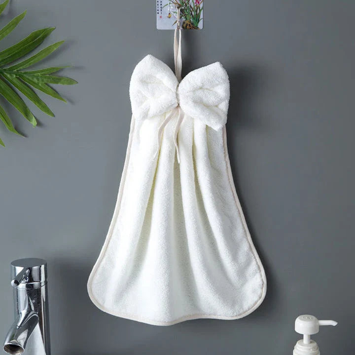 Elegant coral fleece hand towels with a unique bow design, perfect for kitchen and bathroom use