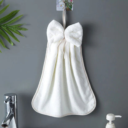 Elegant coral fleece hand towels with a unique bow design, perfect for kitchen and bathroom use