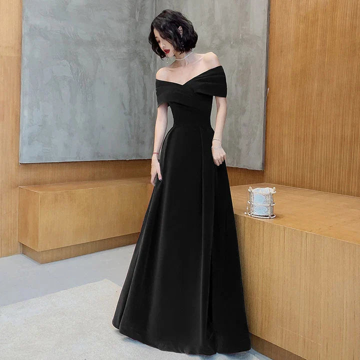 Off-shoulder wine red bridal dress with long, flowing skirt and tight waist for a sophisticated, elegant look