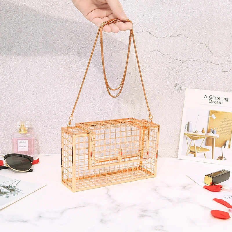 A sophisticated British-designed metal mesh clutch bag with a chain strap, available in various colours and chain styles
