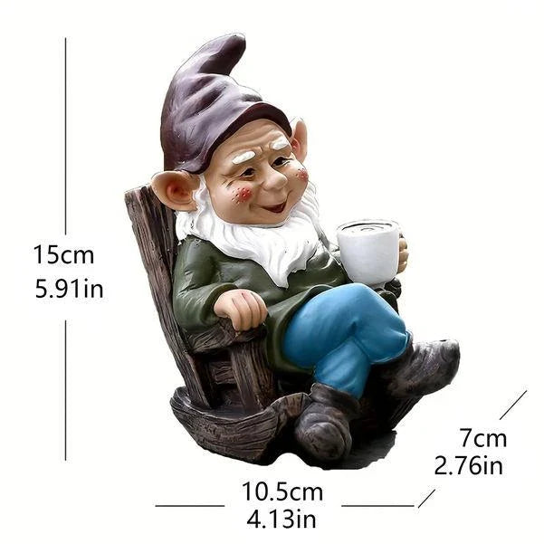 A charming garden gnome ornament made of durable resin, sitting in a rocking chair and sipping tea, adding whimsical personality to an outdoor space
