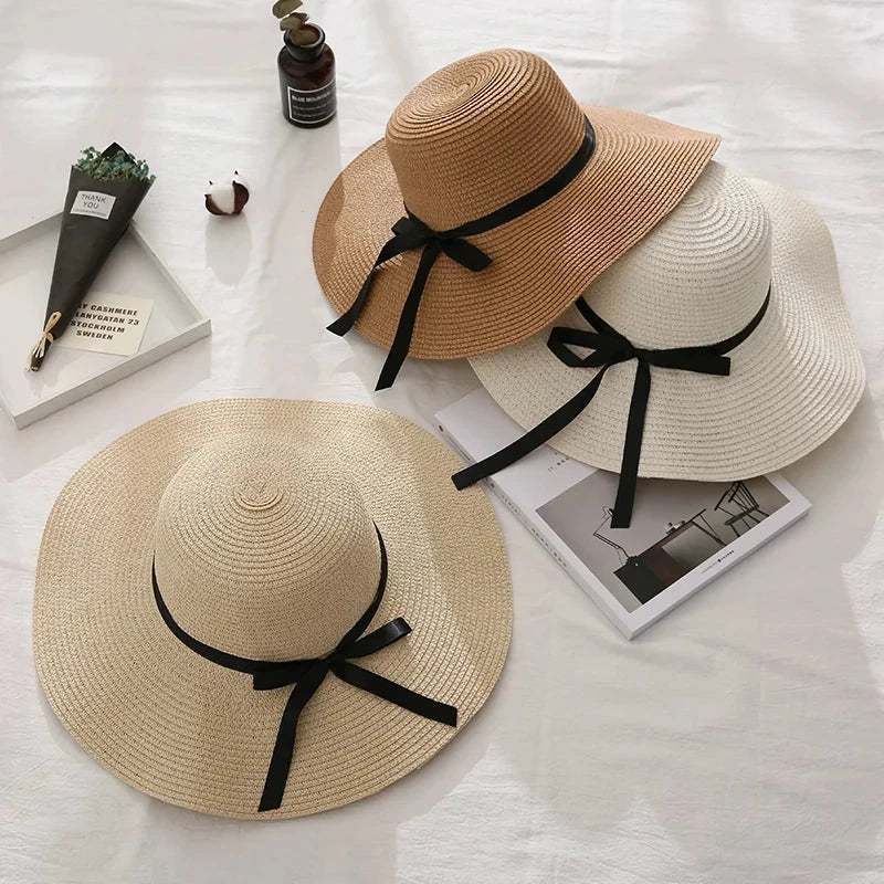 Fashionable straw hat for women with wide brim, foldable design, and stylish bow detail
