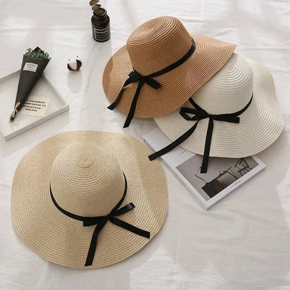 Fashionable straw hat for women with wide brim, foldable design, and stylish bow detail