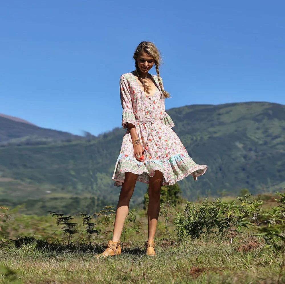 Elegant Bohemian-inspired pleated print dress in a vibrant pink colour, perfect for a day at the British seaside resort.