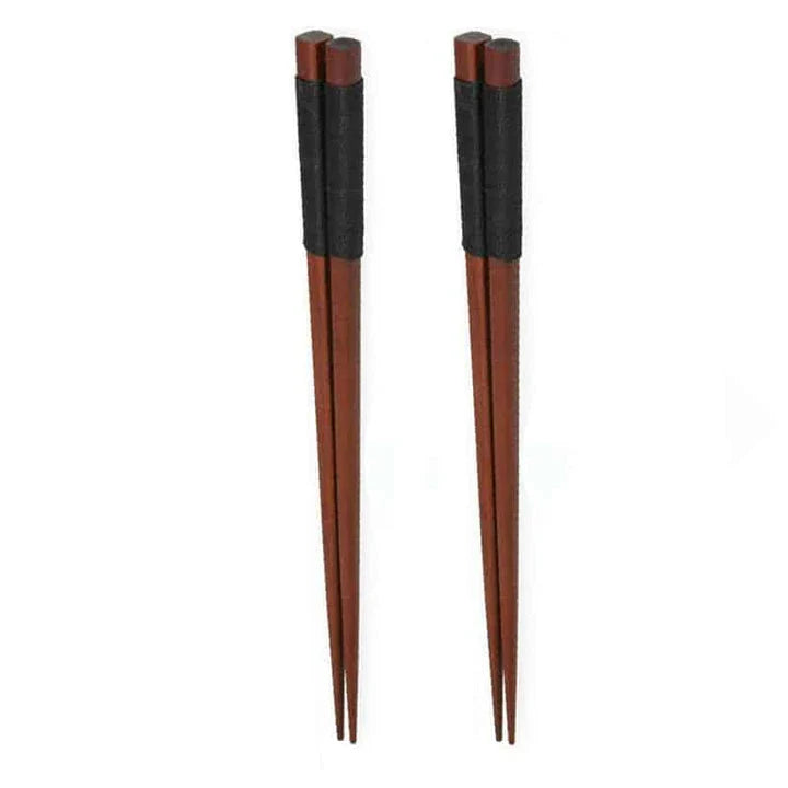 A set of four high-quality wooden chopsticks in a sleek, Japanese-inspired design