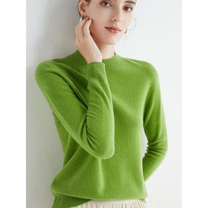 A woman wearing a luxurious Merino wool mock-neck jumper in a stylish autumnal outfit