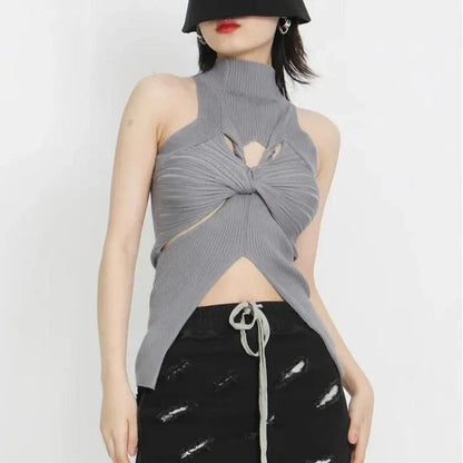 Elegant and versatile knitted sleeveless tank top with a unique hollow-out design, perfect for chic British style