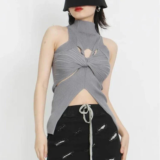 Elegant and versatile knitted sleeveless tank top with a unique hollow-out design, perfect for chic British style