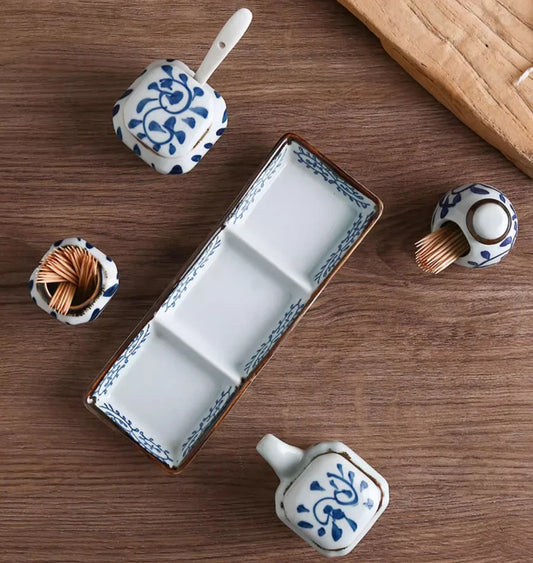 Premium four-piece ceramic seasoning set with oil, vinegar, seasoning, and toothpick holder for a stylish and organized kitchen