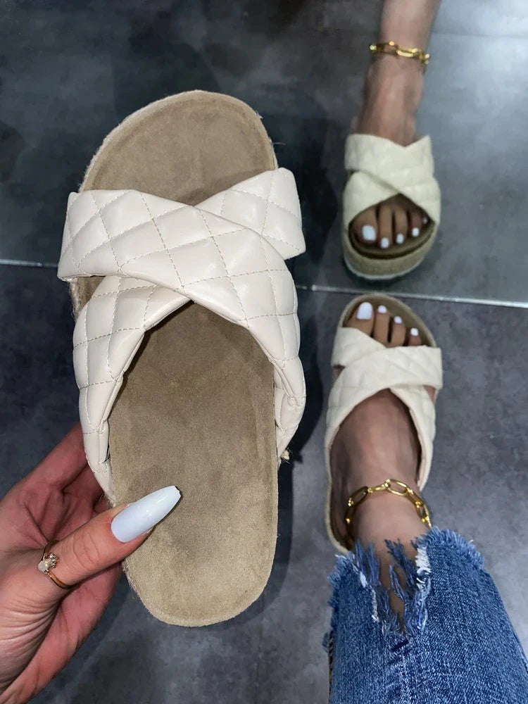 Elegant cross-toe platform sandals and slippers in a neutral creamy white hue, showcasing a contemporary and refined design for the discerning woman