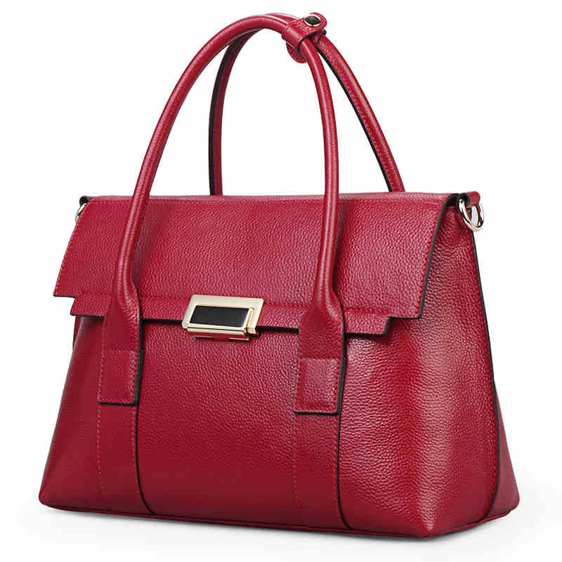 Premium first-layer cowhide leather shoulder bag with adjustable strap, spacious interior, and classic fashion design