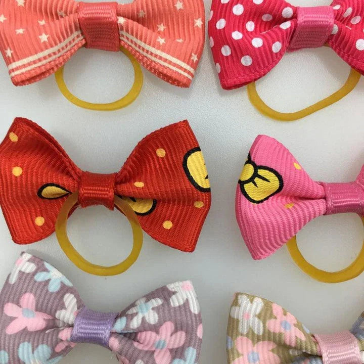 Colourful pet hair bows in assorted colours, made with premium ribbon and rubber for a secure and comfortable fit.