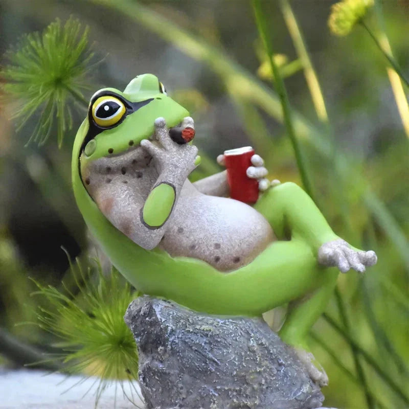 Charming resin frog garden ornaments in various poses and colours, perfect for adding a whimsical touch to outdoor spaces.