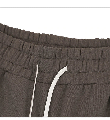 Premium loose-fit sports shorts with eye-catching printed patterns in black, khaki, and dark grey colours