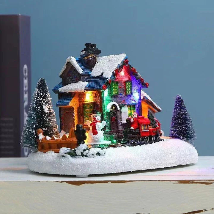 Luminous Christmas house decorations made of resin, with a warm glowing light creating a festive winter scene