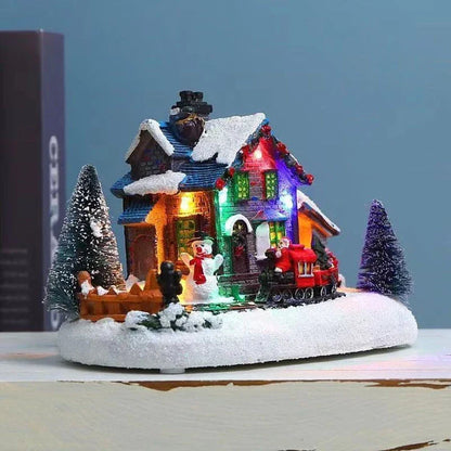 Luminous Christmas house decorations made of resin, with a warm glowing light creating a festive winter scene
