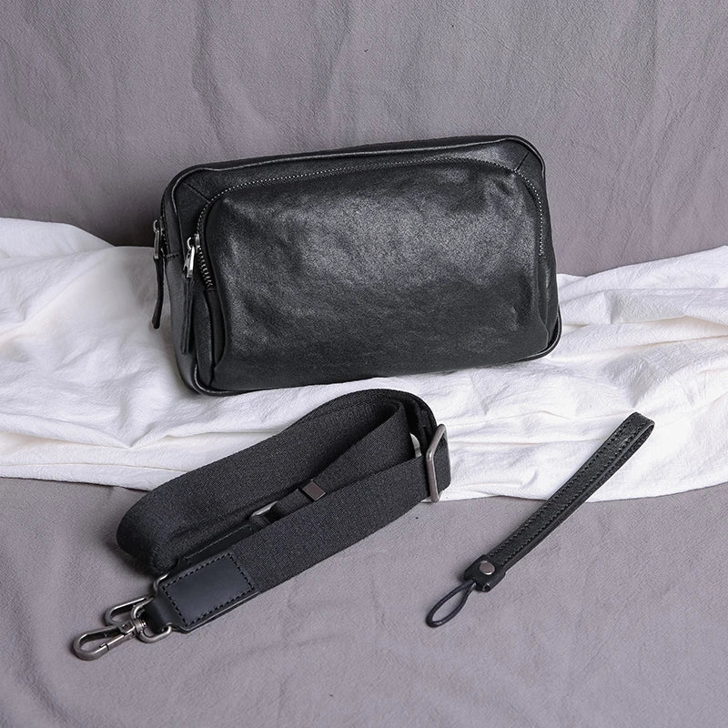 Premium black leather shoulder bag with adjustable strap and multiple compartments for organised storage