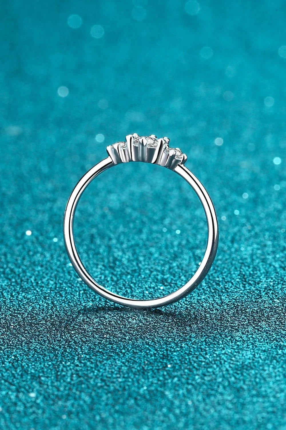 Dazzling sterling silver ring featuring a sparkling moissanite centre stone, perfect for date nights and special occasions.