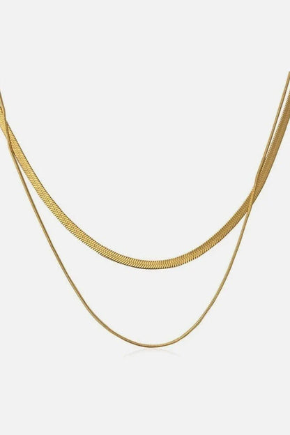 Elegant double-layered necklace in lustrous gold finish, made of premium stainless steel for a versatile and durable accessory.