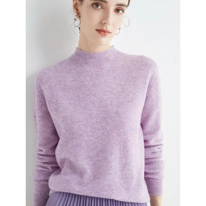 A woman wearing a luxurious Merino wool mock-neck jumper in a stylish autumnal outfit