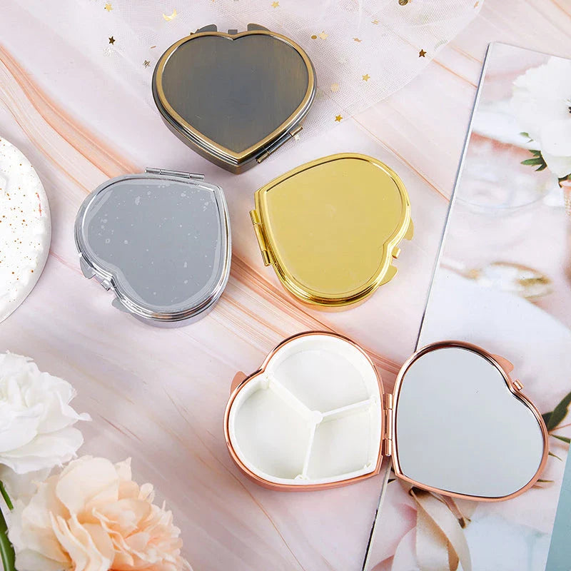 Elegant heart-shaped metal pill box with mirror for organized storage and convenient touch-ups