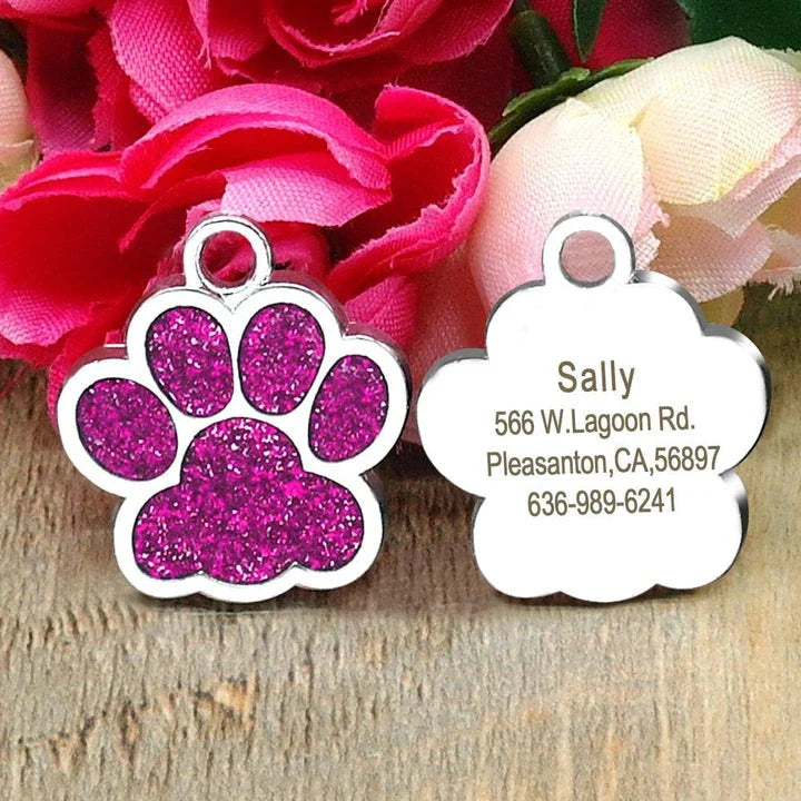 Paw-shaped pet ID tag with rhinestone embellishments, designed for safety and style