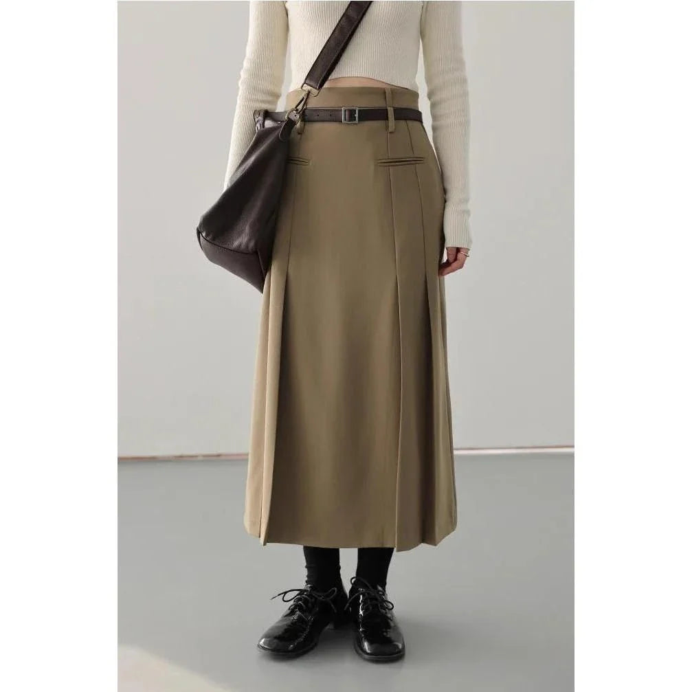 Elegant high-waisted pleated a-line skirt with a flattering silhouette and practical pockets, ideal for autumn and winter in the UK