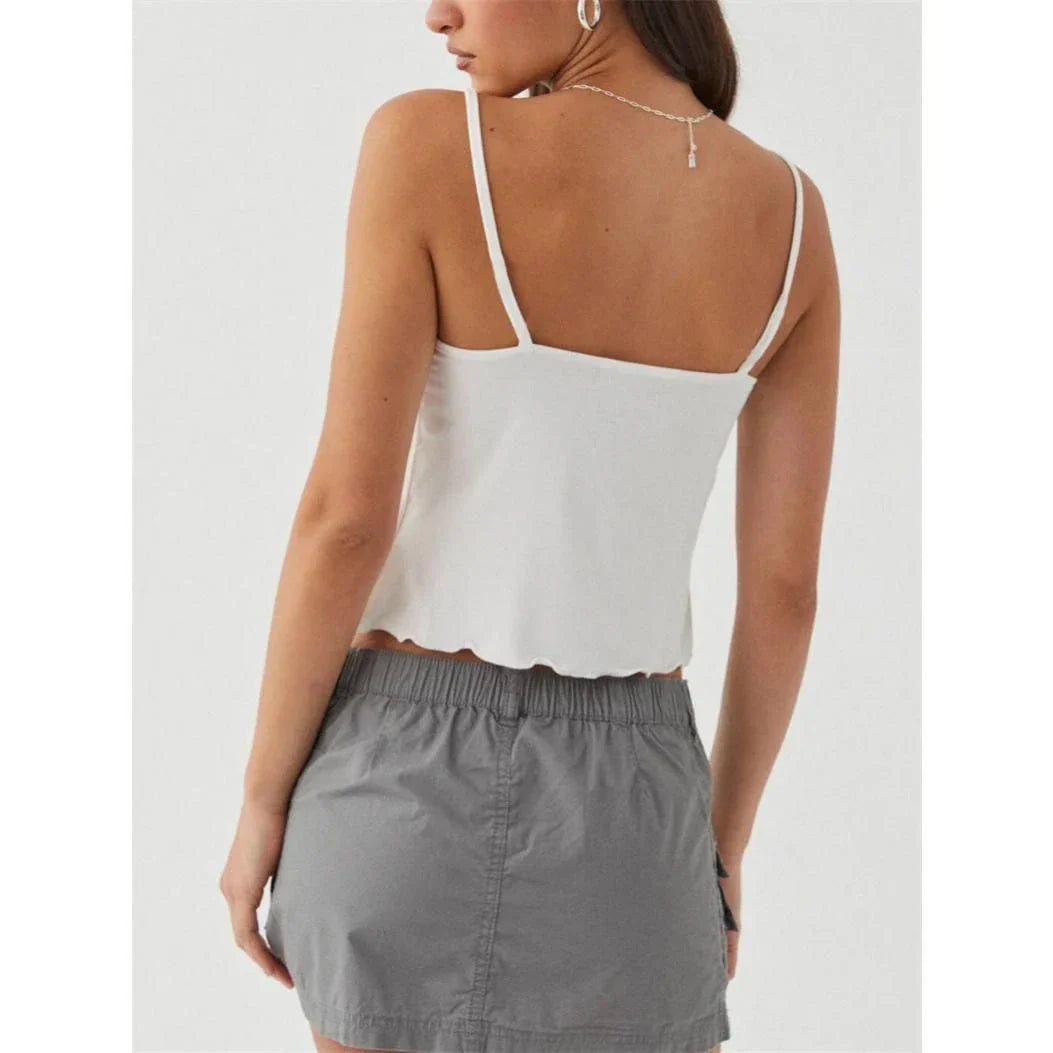 Chic white sleeveless crop top with side bandage detail, perfect for summer fashion