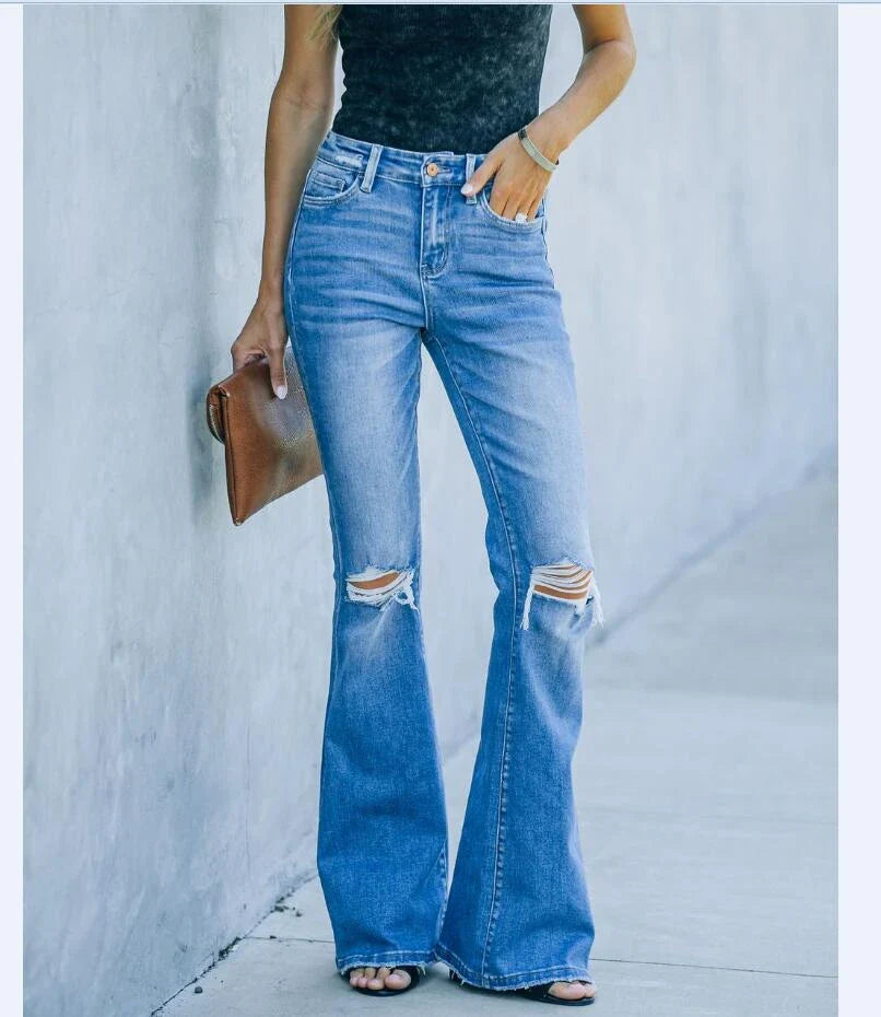 Premium distressed denim trousers for British women, featuring a high-waist silhouette and subtle ripped detailing