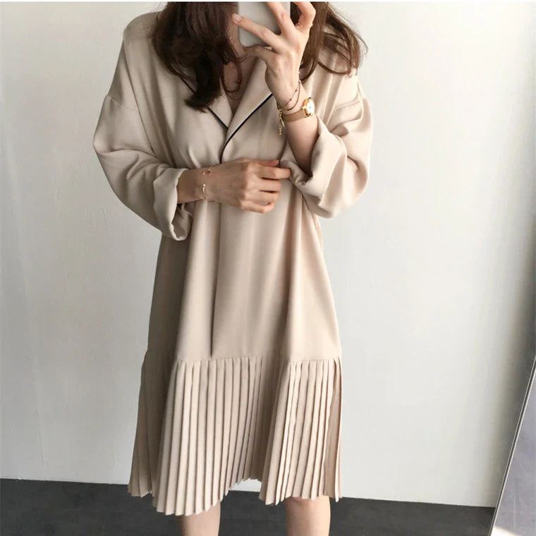 Premium Pleated Suit Dress in Timeless Beige featuring a V-neck, long sleeves, and a mid-length skirt with unique fold stitching detail
