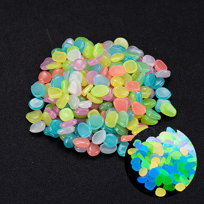 Enchanting glow-in-the-dark decorative pebbles illuminating a garden pathway at night