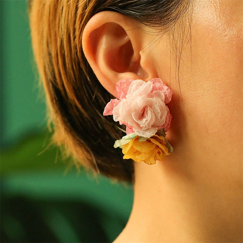 Exquisite handcrafted floral earrings with delicate fabric flowers and alloy accents, showcasing timeless British elegance