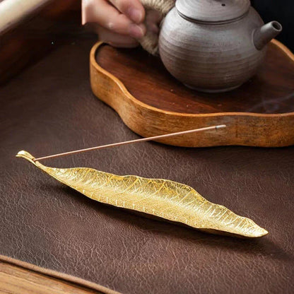 Elegantly crafted copper alloy incense holder with Bodhi leaf design, perfect for meditation and home decor