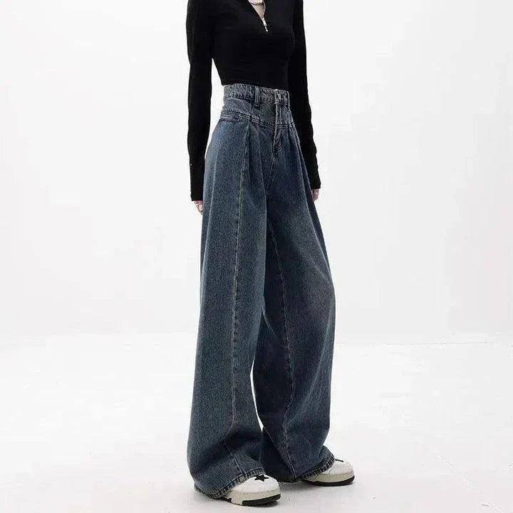 Relaxed fit wide-leg denim trousers in a classic blue colour, featuring a high-waisted design for a flattering fit.