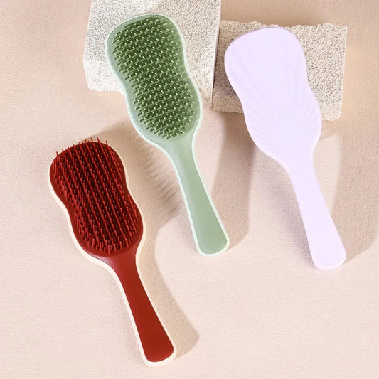 Salon-quality hair straightening comb with air cushion for soothing scalp massage, available in vibrant colours
