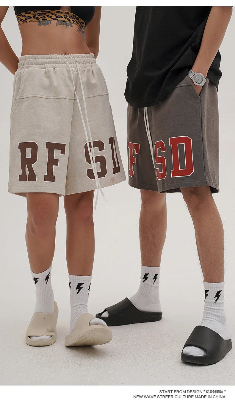 Premium loose-fit sports shorts with eye-catching printed patterns in black, khaki, and dark grey colours