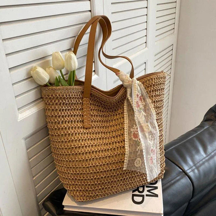 Elegant handcrafted woven straw tote bag in beige colour, perfect for summer outings and carrying essentials