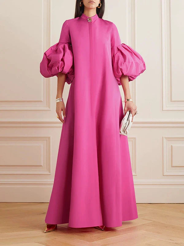 Elegant floral evening gown in a range of vibrant colours, featuring a loose, flattering fit and chic lapel design