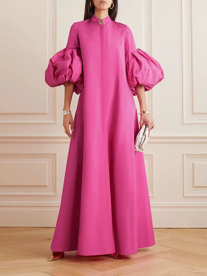 Elegant floral evening gown in a range of vibrant colours, featuring a loose, flattering fit and chic lapel design